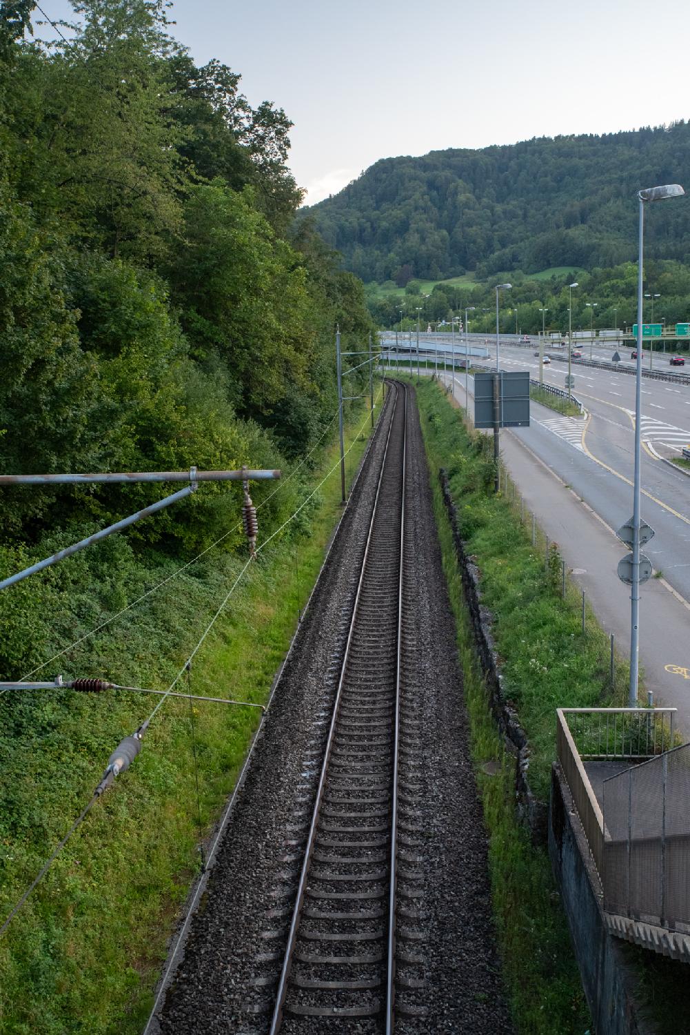 View from above over a railway track and a freeway
