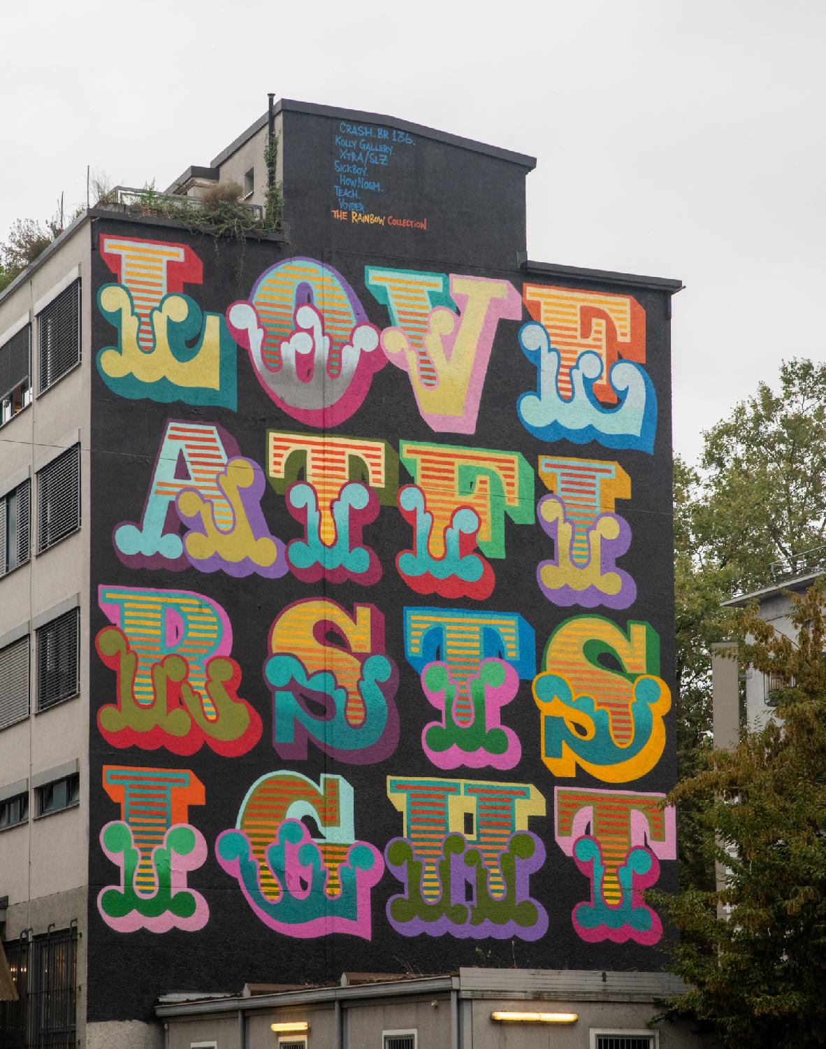 A colorful mural in large letters, reading LOVE ATFI RSTS IGHT (Love At First Sight)